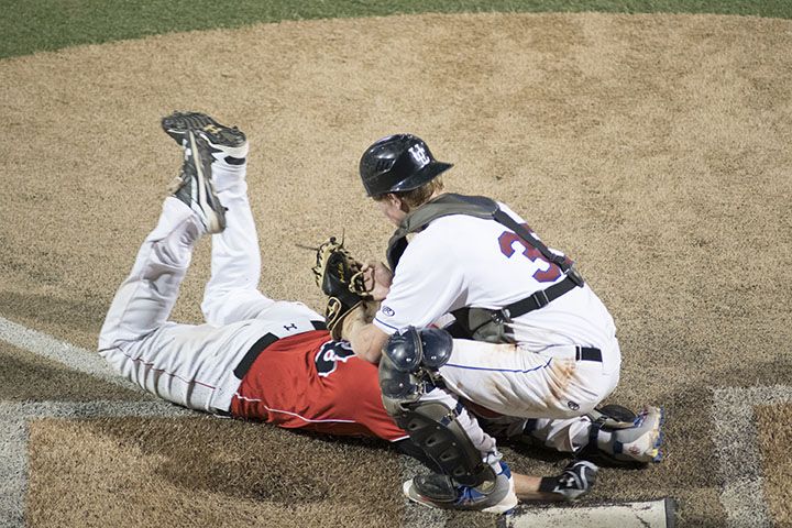 Player sliding into home base